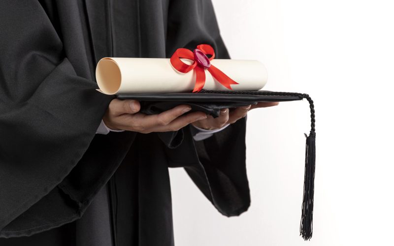 close-up-woman-with-graduation-diploma